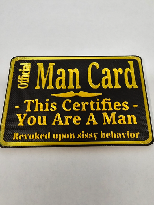 Official Man Card 3D printed plaque with raised gold lettering on black background