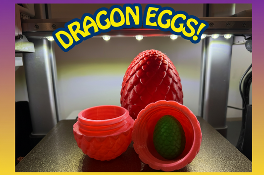 Red scale-textured 3D printed dragon eggs with one open showing a green egg inside