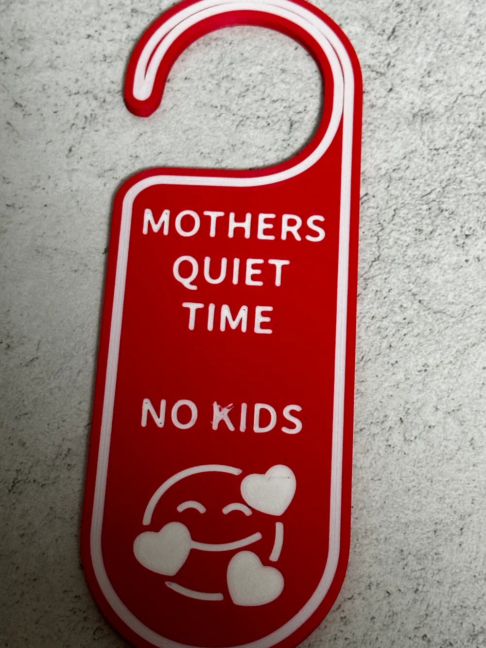 Red and white 3D printed door hanger with text 'MOTHERS QUIET TIME NO KIDS' and smiley face with hearts