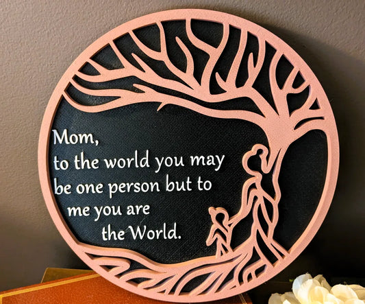 Round 3D printed plaque with pink tree frame and sentiment for moms, includes family figures and stand