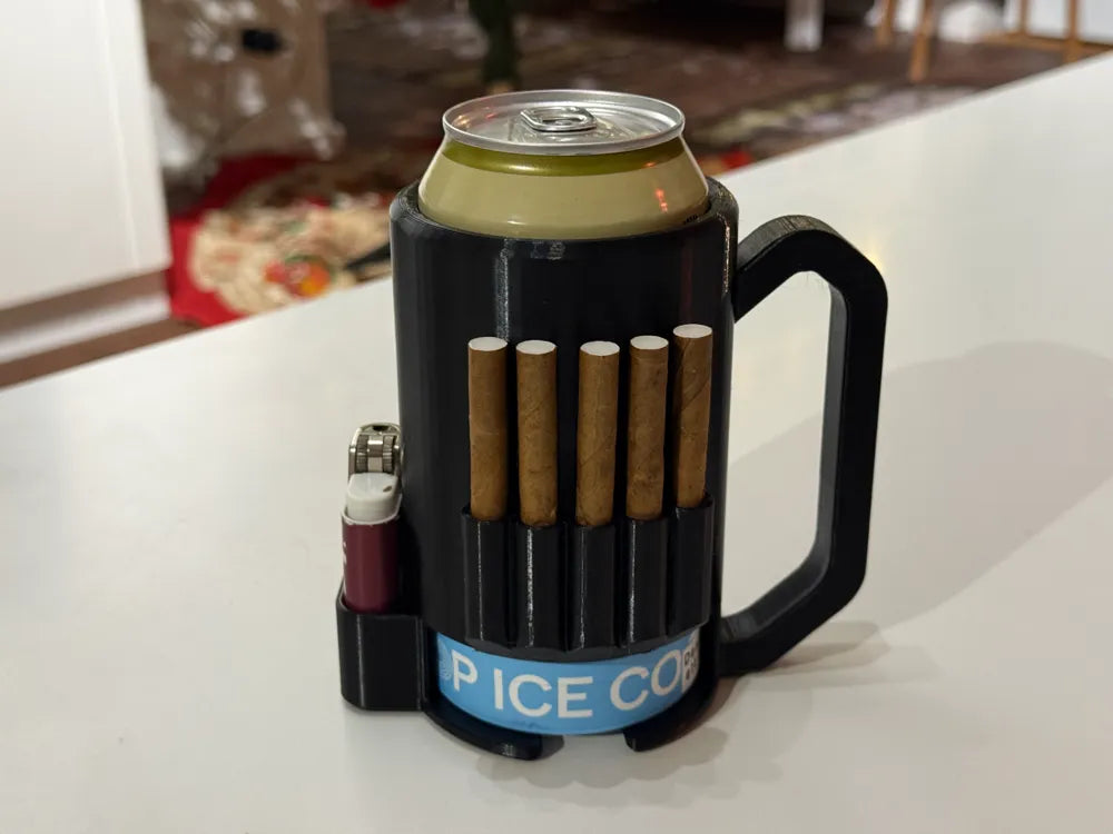 3D printed black can koozie with handle holding a European can, five small cigars in front slots, and a lighter on the side
