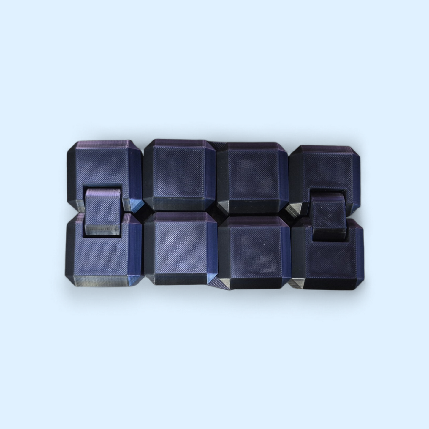 3D printed infinity cube fidget toy showing eight black matte cubes connected to fold endlessly